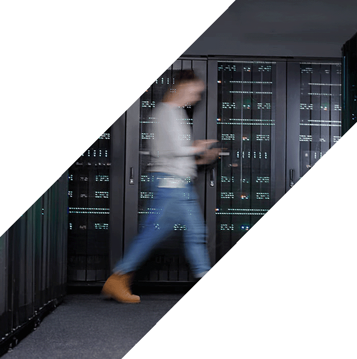 Engineer walking through a data center